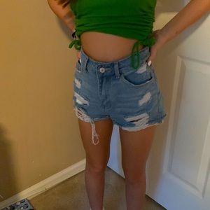 Ripped blue jean shorts medium length